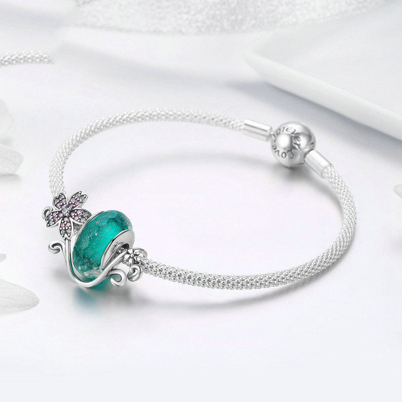 Silver flower bracelet with decorations