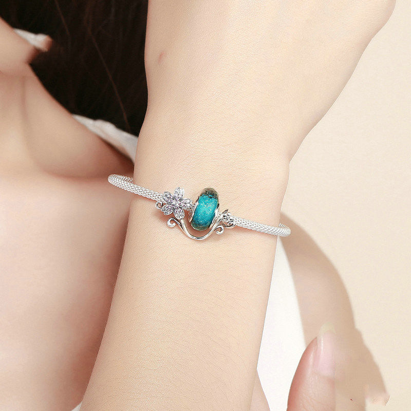 Silver flower bracelet with decorations